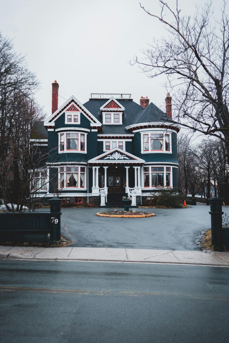 Do Your Deck Ohio LLC Restoration Contractor restores beautiful Victorian-style house in a suburban neighborhood with overcast skies and tree-lined streets.